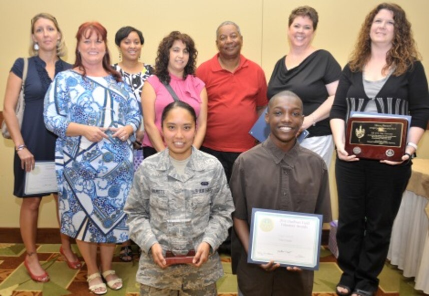 Team Hurlburt Volunteers gather for a group photo during the 2014 Volunteer Recognition Ceremony at the Soundside Club on Hurlburt Field, Fla., May 22, 2014. In 2013, nearly 1,000 Hurlburt volunteers gave their time and contributed 235,000 man-hours in support of base and community events. (U.S. Air Force photo/Senior Airman Kentavist P. Brackin)