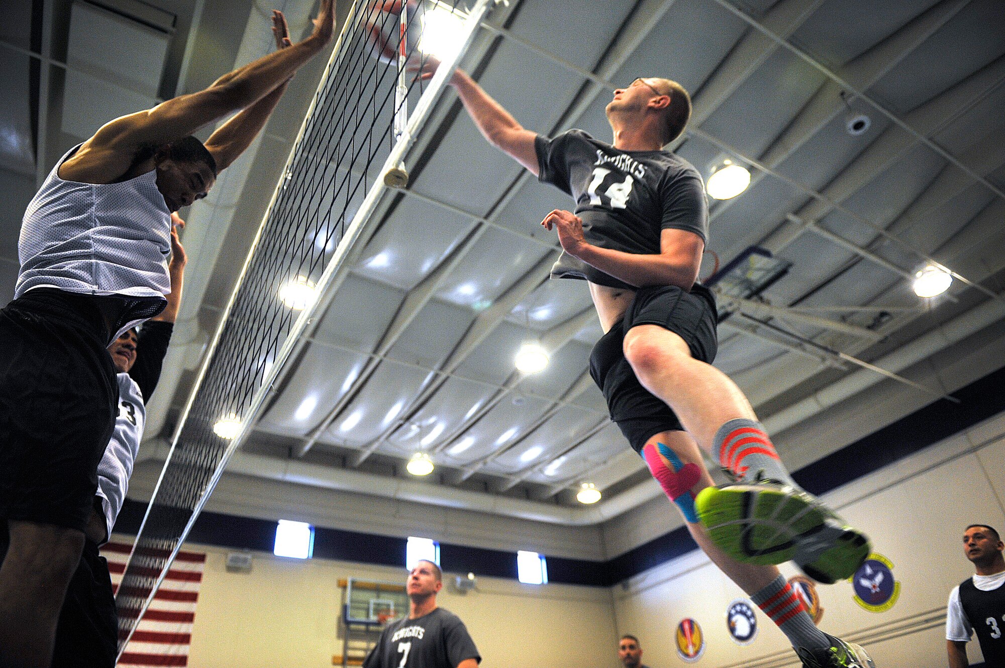 Peterson's Karl Ahner goes for a spike against Fort Carson during the 2014 Rocky Mountain Regional Volleyball Tournament May 17, 2014, at Schriever Air Force Base, Colo. The Schriever Fitness Center hosted the round robin tournament where volleyball teams from Fort Carson, Schriever, Peterson and Buckley Air Force Bases and U.S. Air Force Academy competed. (U.S. Air Force photo/Dennis Rogers)