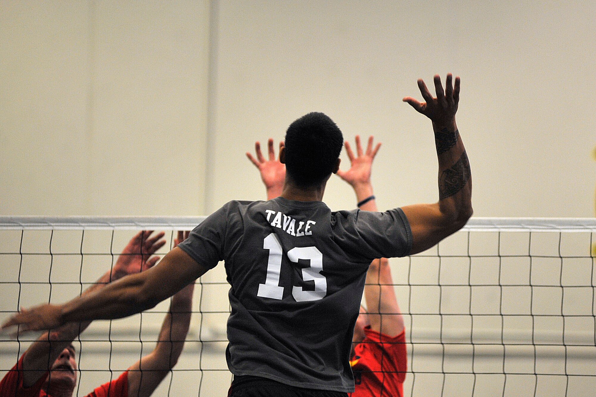 Peterson's Nap Tavale prepares to spike the ball against Schriever during the 2014 Rocky Mountain Regional Volleyball Tournament May 17, 2014, at Schriever Air Force Base, Colo.  The Schriever Fitness Center hosted the round robin tournament where volleyball teams from Fort Carson, Schriever, Peterson and Buckley Air Force Bases and U.S. Air Force Academy competed. Schriever won the tournament. (U.S. Air Force photo/Dennis Rogers)