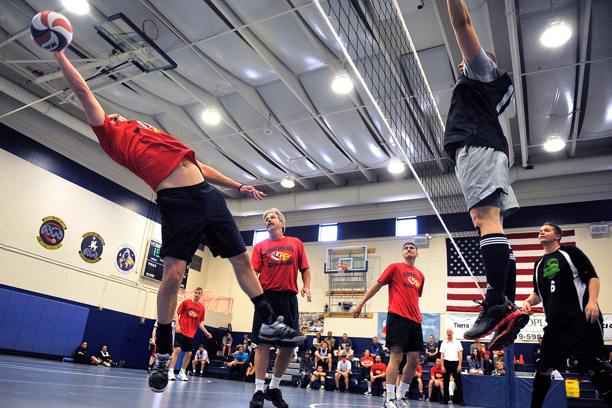Schriever's Jon Szul stretches to save a shot against Buckley during the 2014 Rocky Mountain Regional Volleyball Tournament May 17, 2014, at Schriever Air Force Base, Colo.  The Schriever Fitness Center hosted the round robin tournament where volleyball teams from Fort Carson, Schriever, Peterson and Buckley Air Force Bases and U.S. Air Force Academy competed. Schriever won the tournament. (U.S. Air Force Photo/Dennis Rogers)