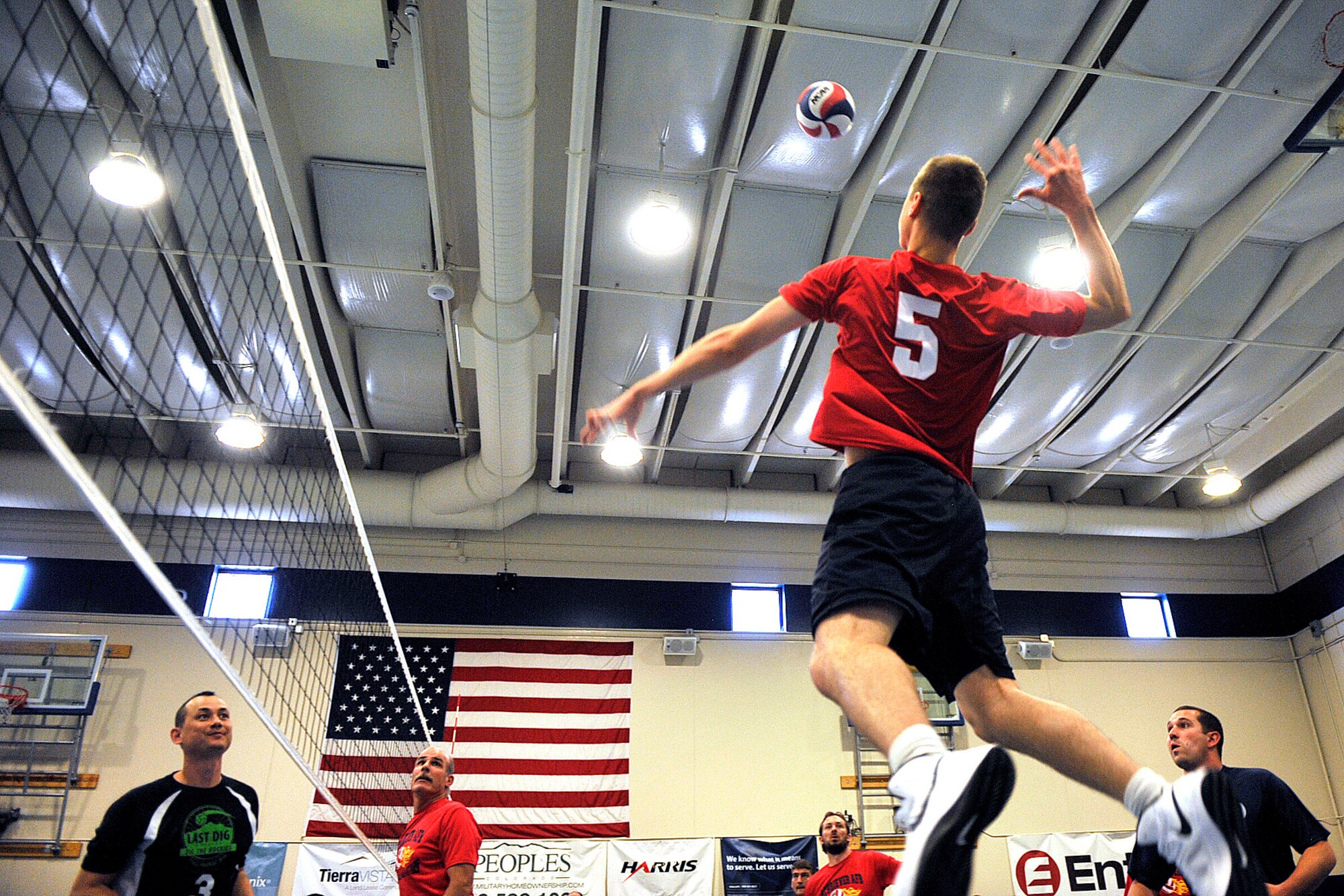 Schriever’s Jonathan Plyler prepares to spike the ball during a preliminary match against Buckley during the 2014 Rocky Mountain Regional Volleyball Tournament May 17, 2014, at Schriever Air Force Base, Colo. The Schriever Fitness Center hosted the tournament. (U.S. Air Force photo/Dennis Rogers)