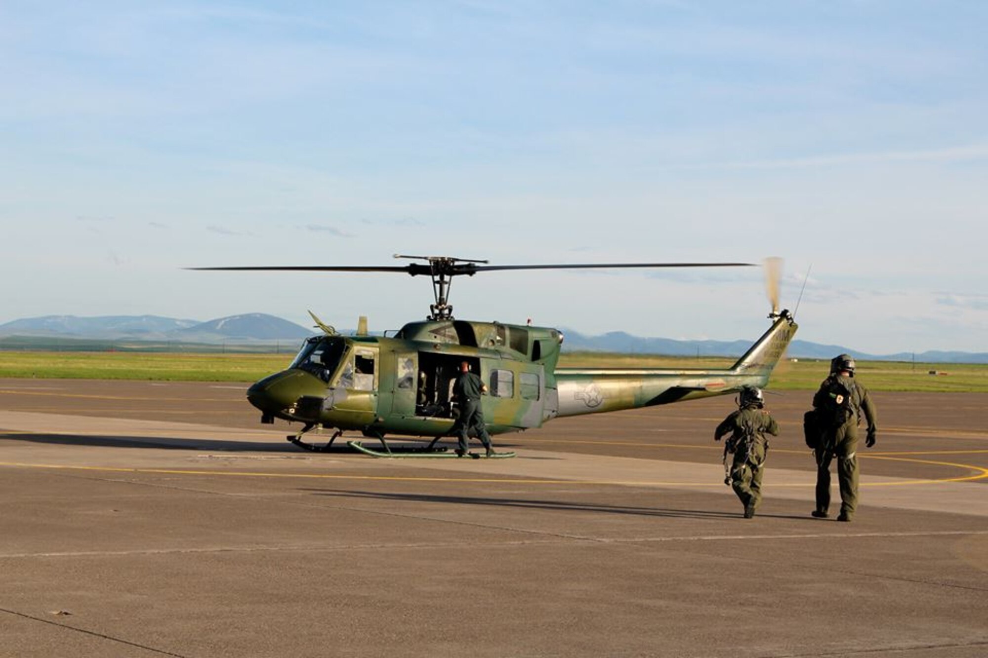 Aircrew members board “Air Force Rescue 22,” a UH-1N helicopter assigned to the 40th Helicopter Squadron, May 25 and prepare to fly their second rescue mission of the day.  The 40th HS recorded their 400th and 401st saves in a single day, first rescuing an injured hiker near Hamilton, Mont., and soon after extracting avalanche survivors from a mountain near Butte, Mont. (Air Force photo / Joshua Aycock)