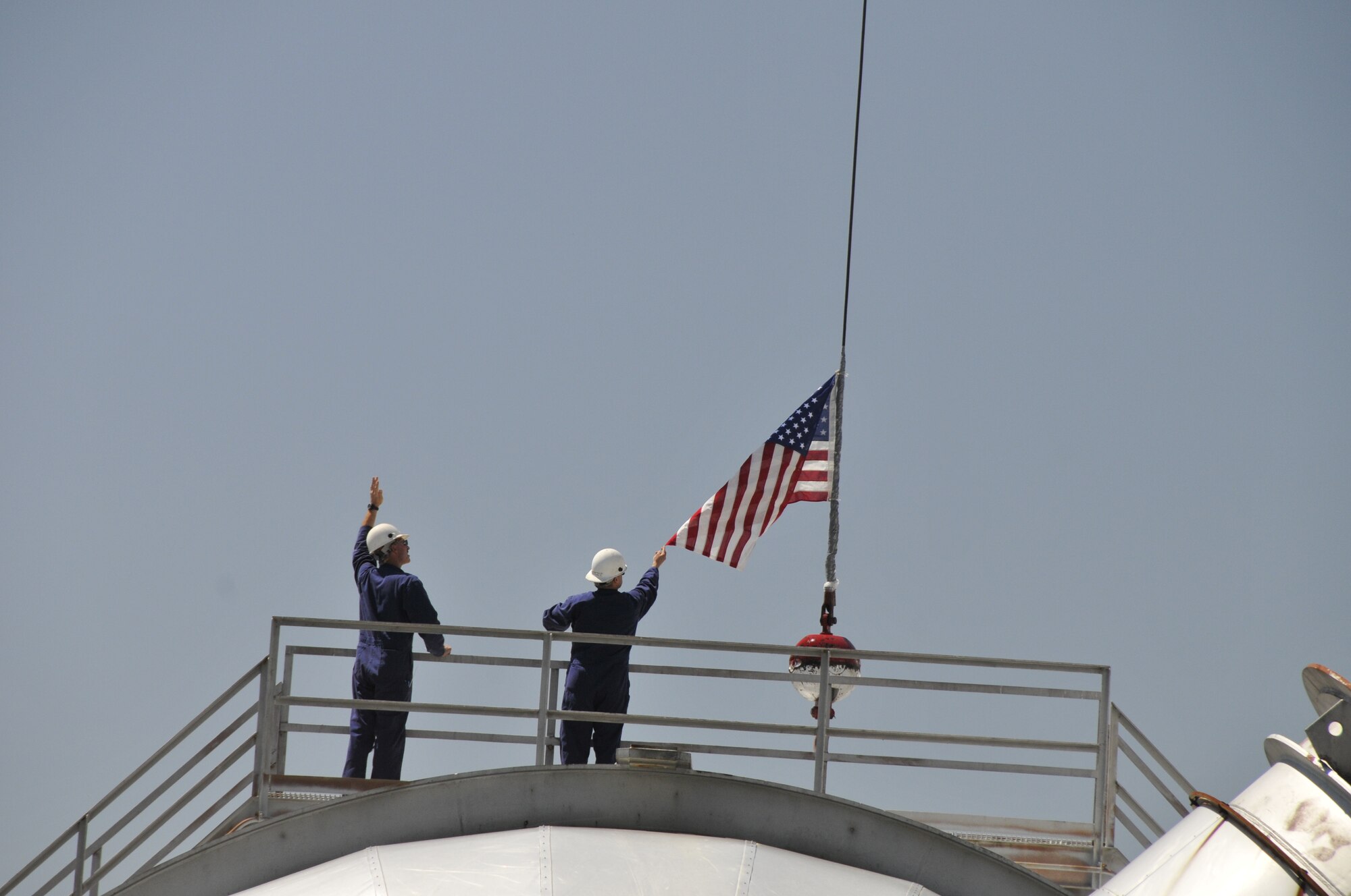 Recent Arnold Engineering Development Complex (AEDC) retirees Rosemary Matty and Jerry Kitchens received U.S. flags that were flown over the Complex’s Aeropropulsion Systems Test Facility (ASTF), for turbine engine testing, as part of their retirement. Matty and Kitchens worked on systems sustainment projects in ASTF where a crane is currently in place for the facilities exhaust system. The flags were suspended from the crane. Matty, previously an AEDC Advanced Large Military Engine Capability (ALMEC) program manager, retired with 33 years of service at AEDC. Kitchens was an AEDC Aeropropulsion Sustainment Branch director and retired with 37 years of service. (Photos by Rick Goodfriend)
