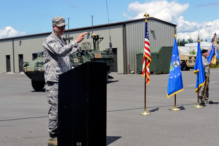 Col. James Bowen Jr., 1st Air Support Operations Group commander, speaks to attendees of the 1st Air Support Operations Group change of command ceremony, May 27, 2014 at Joint Base Lewis-McChord, Washington. During the ceremony, Bowen took command from Col. Bruce Beyerly who retired later that afternoon. (U.S. Air Force photo/Staff Sgt. Russ Jackson)