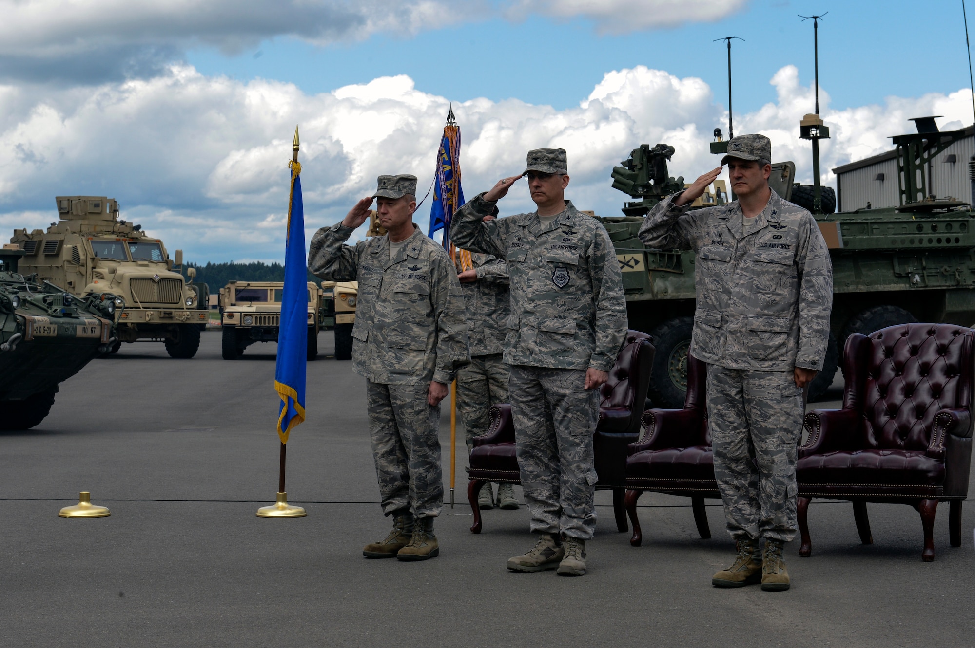 Brig. Gen. Mark Kelly, 345th commander (left), Col. Bruce Beyerly, outgoing 1st Air Support Operations Group commander (center), and Col. James Bowen Jr., incoming 1st Air Support Operations Group commander (right), prepare for a change of command May 27, 2014 at Joint Base Lewis-McChord, Washington. Bowen assumed command of more than 550 active duty military and civilian personnel from four squadrons and four detachments which provide combat-ready Tactical Air Control Party and Battlefield Weather assets to combat units. (U.S. Air Force photo/Staff Sgt. Russ Jackson)