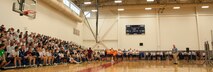 Mike Snodgrass, 436th Airlift Wing community support coordinator, talks to Team Dover before the start of Wingman Day May 22, 2014, at the gym on Dover Air Force Base, Del. He used his speech to explain why resiliency is important in today's Air Force and why Airmen should have adequate support networks, which lower the impact of adversity. (U.S. Air Force photo/Senior Airman Jared Duhon) 