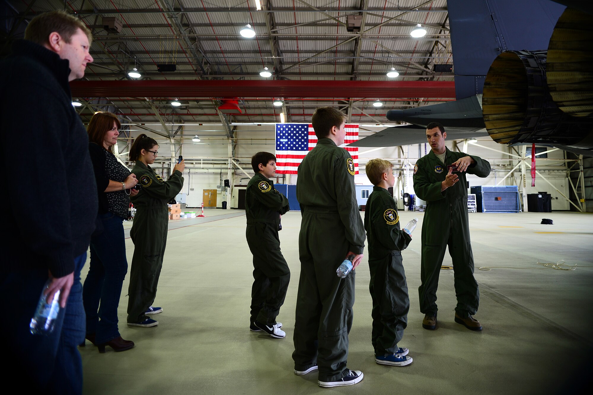 Maj. Jason Bianchi, 493rd Fighter Squadron pilot, explains the thrusters on an F-15C Eagle during a “Pilot for a Day” event at Royal Air Force Lakenheath, England, May 22, 2014. The program allows children with a life-threatening illness or condition to visit RAF Lakenheath and experience what it’s like to be a pilot. (U.S. Air Force photo by Staff Sgt. Emerson Nuñez/Released)