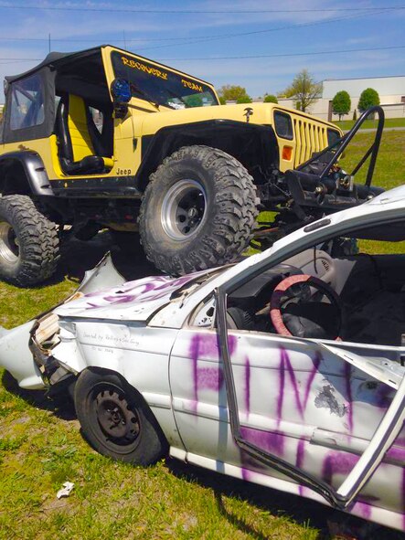 AEDC Team Remember offered opportunities for Coffee County Relay for Life participants to smash the team’s car as a fundraiser at the Coffee County Fairgrounds last month. (Photo provided)