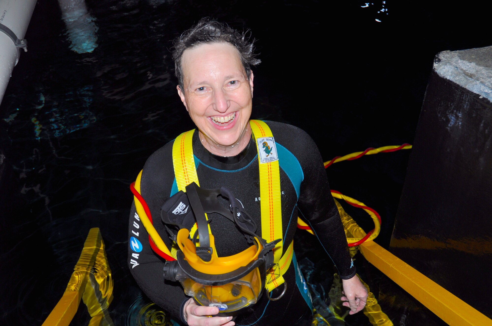 AEDC physicist Mary Fedde, also a certified diver, exits one of the tanks at the Tennessee Aquarium after a dive. (Photo provided)