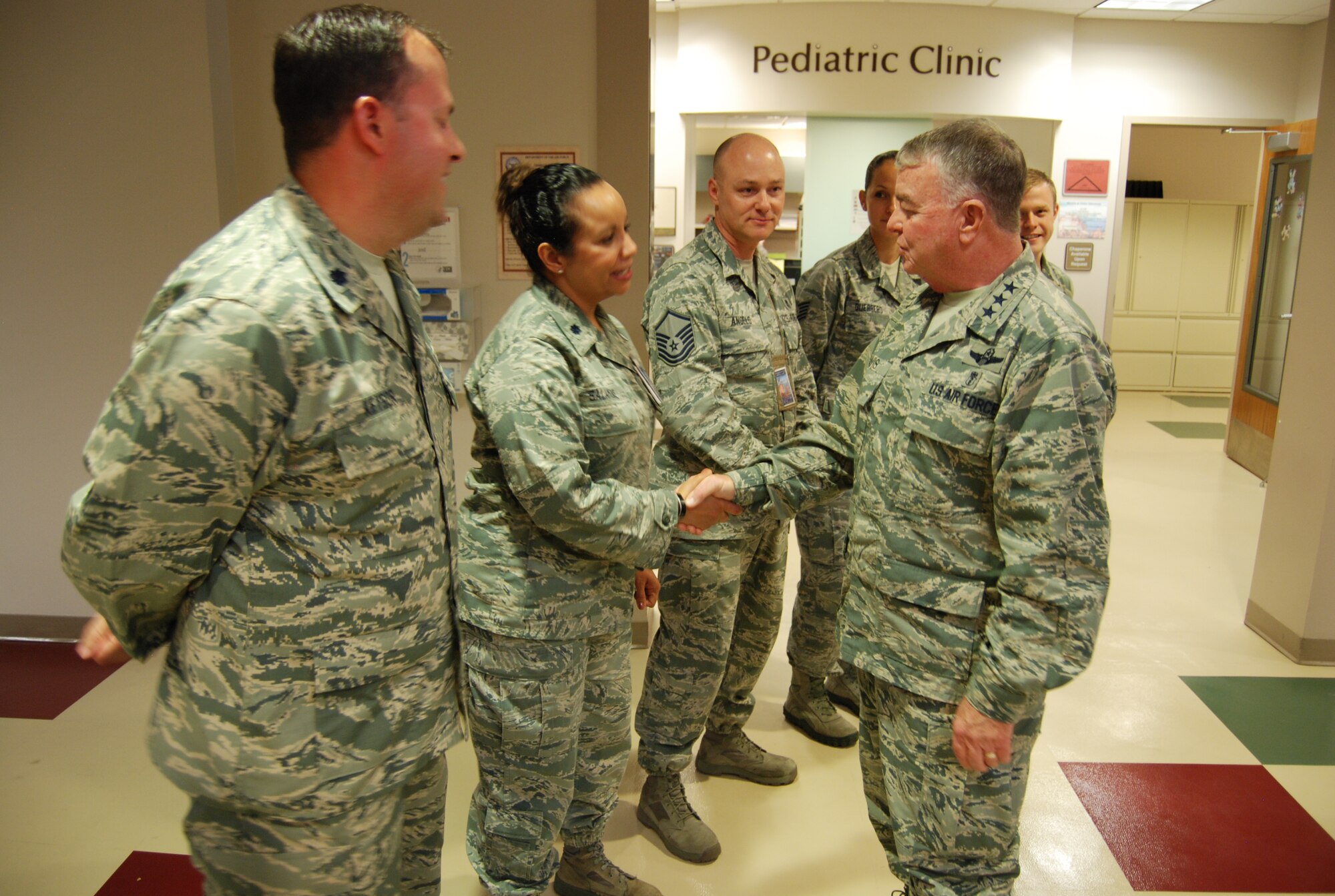 PETERSON AIR FORCE BASE, Colo. – Members of the Peterson AFB Pediatric Clinic greet Lt. Gen. Thomas Travis, Air Force Surgeon General. Travis toured various areas of the 21st Medical Group where he learned about 21st MDG plans, interacted with Airmen, addressed concerns and learned about specific jobs. (U.S. Air Force photo/Michael Golembesky)