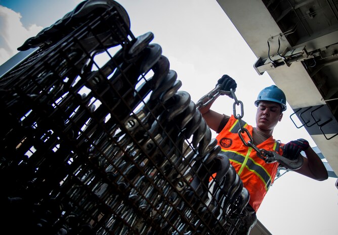 A Sailor re-stocks chains during Exercise Turbo Distribution, a U.S. Transportation Command exercise May 21, 2014, aboard the USNS Watkins (T-AKR-315), moored at Wharf Alfa on Joint Base Charleston, S.C. Held May 15 through 22, Exercise Turbo Diesel allowed members of TRANSCOM’s 597th Transportation Battalion, Military Sealift Command’s Expeditionary Port Unit 110, Naval Cargo Handling Battalion One, along with JB Charleston’s 841st TB and ASLAC, the opportunity to exercise their skills in a joint envoironment. (U.S. Air Force photo/ Airman 1st Class Clayton Cupit))