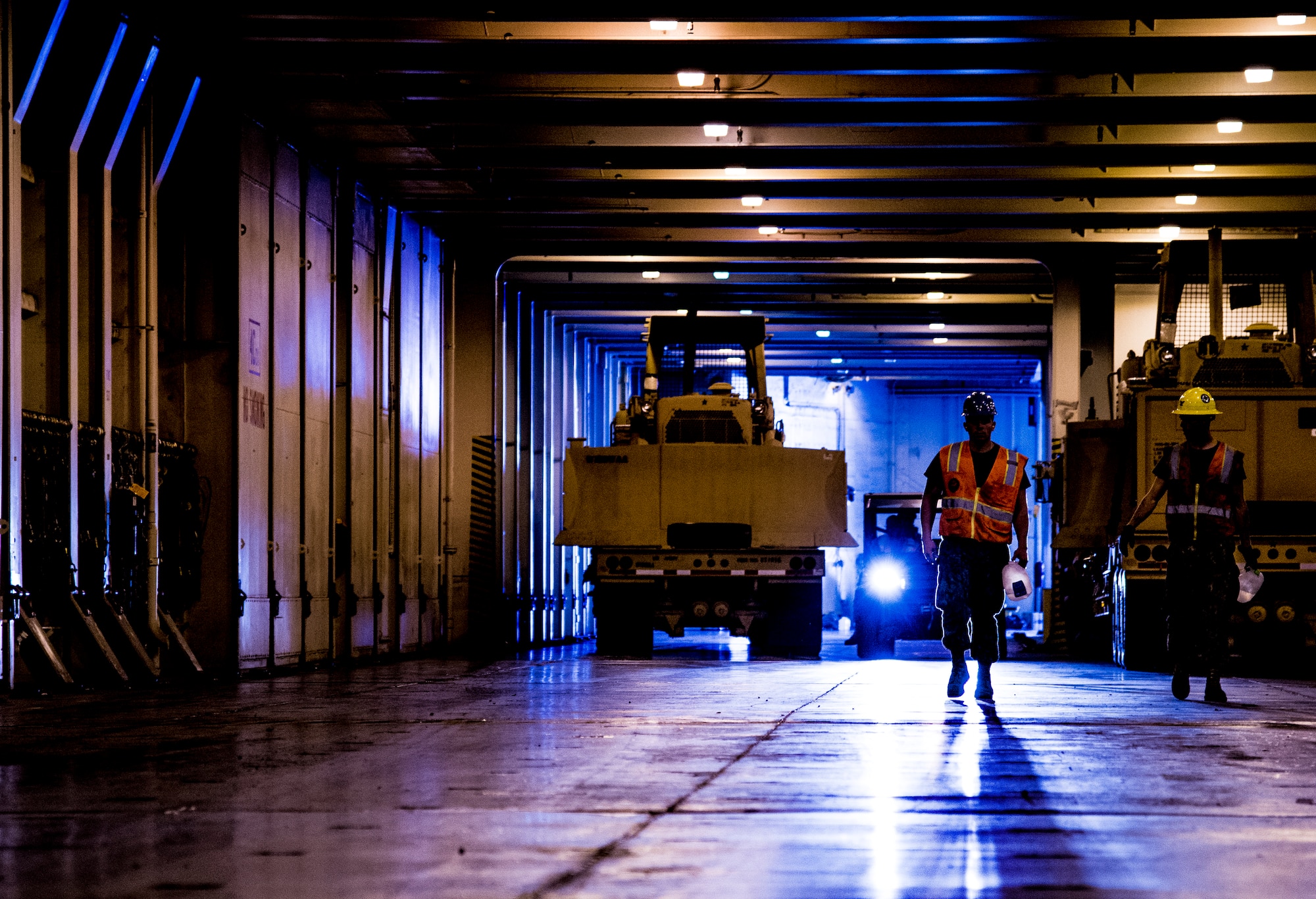 Sailors maneuver machinary during Exercise Turbo Distribution, a U.S. Transportation Command exercise May 21, 2014, aboard the USNS Watkins (T-AKR-315), moored at Wharf Alfa on Joint Base Charleston, S.C. Held May 15 through 22, Exercise Turbo Diesel allowed members of TRANSCOM’s 597th Transportation Battalion, Military Sealift Command’s Expeditionary Port Unit 110, Naval Cargo Handling Battalion One, along with JB Charleston’s 841st TB and ASLAC, the opportunity to exercise their skills in a joint envoironment. (U.S. Air Force photo/ Airman 1st Class Clayton Cupit)