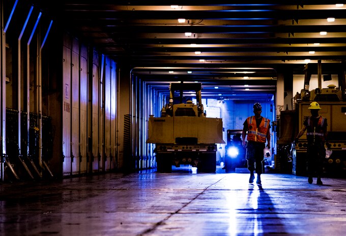 Sailors maneuver machinary during Exercise Turbo Distribution, a U.S. Transportation Command exercise May 21, 2014, aboard the USNS Watkins (T-AKR-315), moored at Wharf Alfa on Joint Base Charleston, S.C. Held May 15 through 22, Exercise Turbo Diesel allowed members of TRANSCOM’s 597th Transportation Battalion, Military Sealift Command’s Expeditionary Port Unit 110, Naval Cargo Handling Battalion One, along with JB Charleston’s 841st TB and ASLAC, the opportunity to exercise their skills in a joint envoironment. (U.S. Air Force photo/ Airman 1st Class Clayton Cupit)