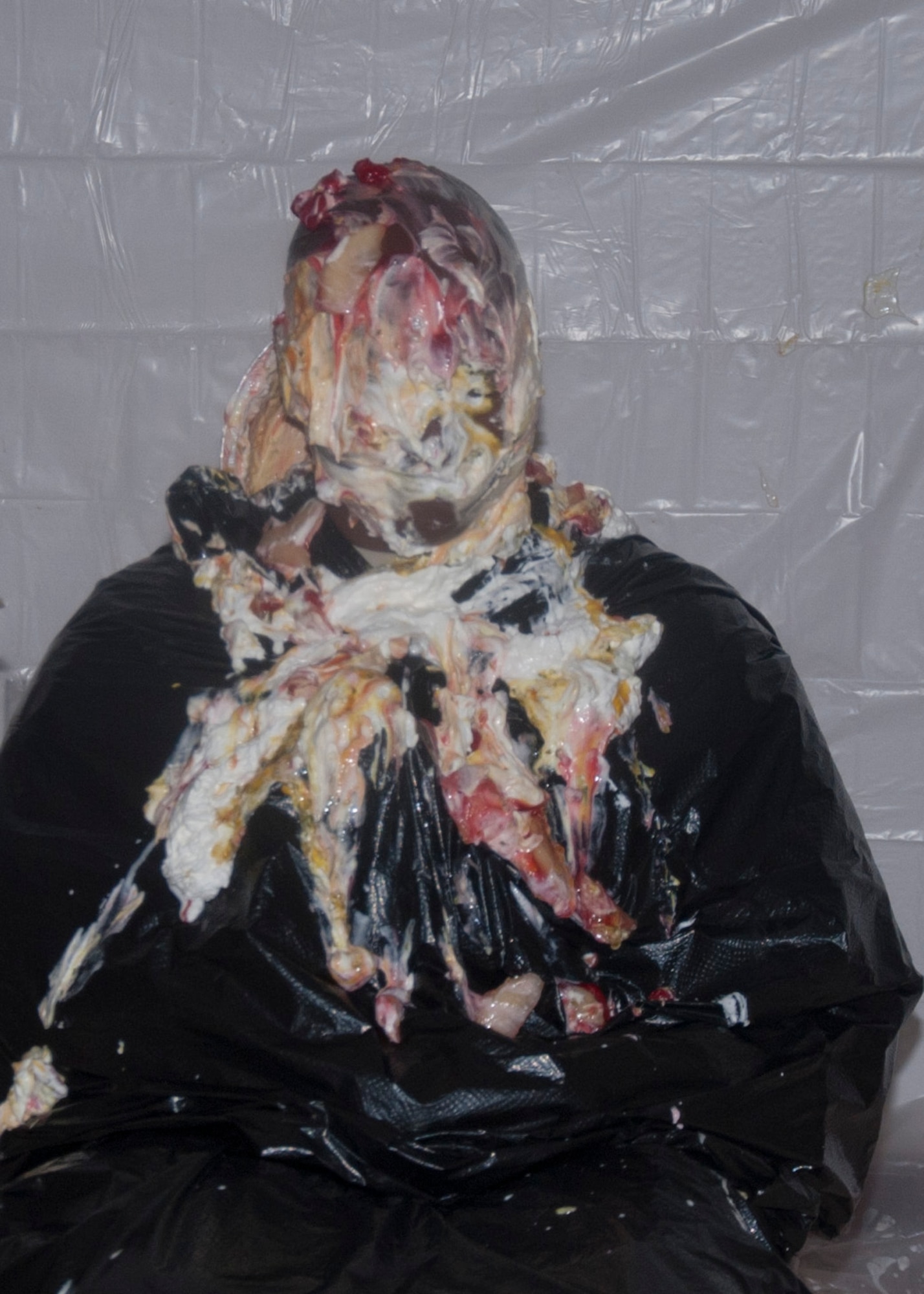 Col. Carl Jones, 90th Missile Wing vice commander, sits caked in whipped cream after receiving a double dose of pies May 27 as part of a fundraising opportunity for the wing’s dining out. 