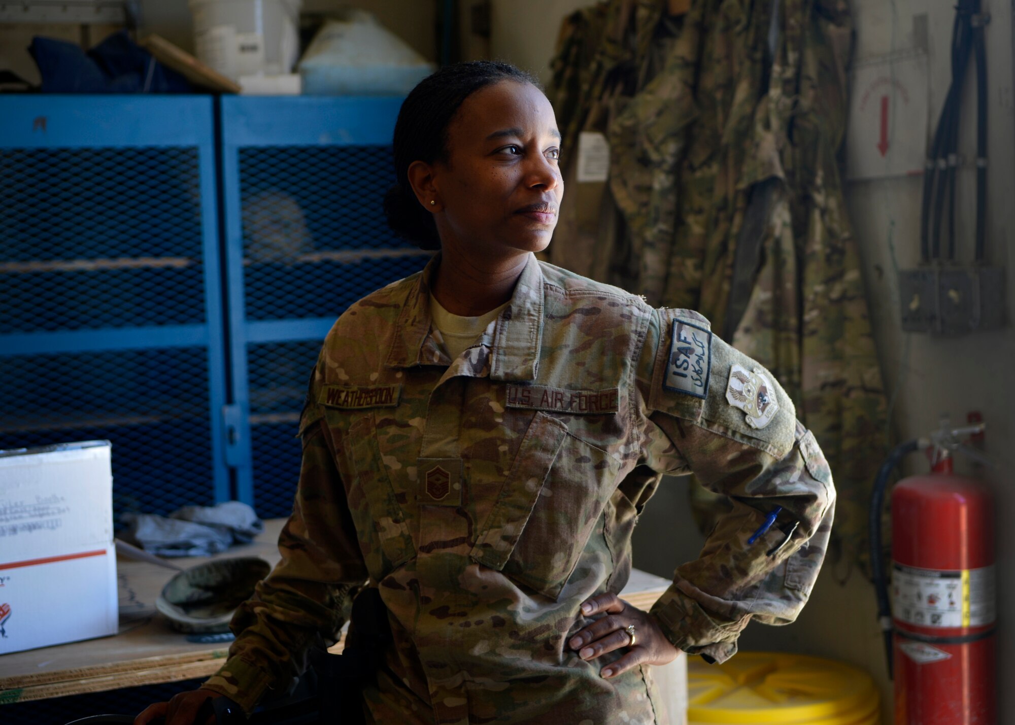 Senior Master Sgt. Gloria Weatherspoon, 455th Expeditionary Maintenance Squadron first sergeant, visits Airmen from the squadron May 21, 2014 at Bagram Airfield, Afghanistan.  As a first sergeant, Weatherspoon takes care of Airmen’s needs and reports to the unit commander on matters that can affect welfare, morale and conduct.  Weatherspoon is deployed from Travis Air Force Base, Calif. and a native of Philadelphia, Pa. (U.S. Air Force photo by Staff Sgt. Evelyn Chavez/Released)
