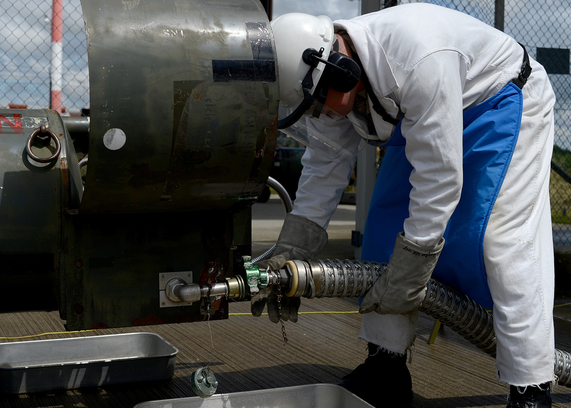 U.S. Air Force Staff Sgt. Kevin Moore, a 52nd Logistics Readiness Squadron cryogenics storage supervisor from Monroe, Mich., prepares to fill a liquid oxygen storage transfer tank at Spangdahlem Air Base, Germany, May 23, 2014. One gallon of liquid oxygen weighs 9.5 pounds and expands approximately 114.5 times once converted to a gas. (U.S. Air Force photo by Airman 1st Class Kyle Gese/Released)