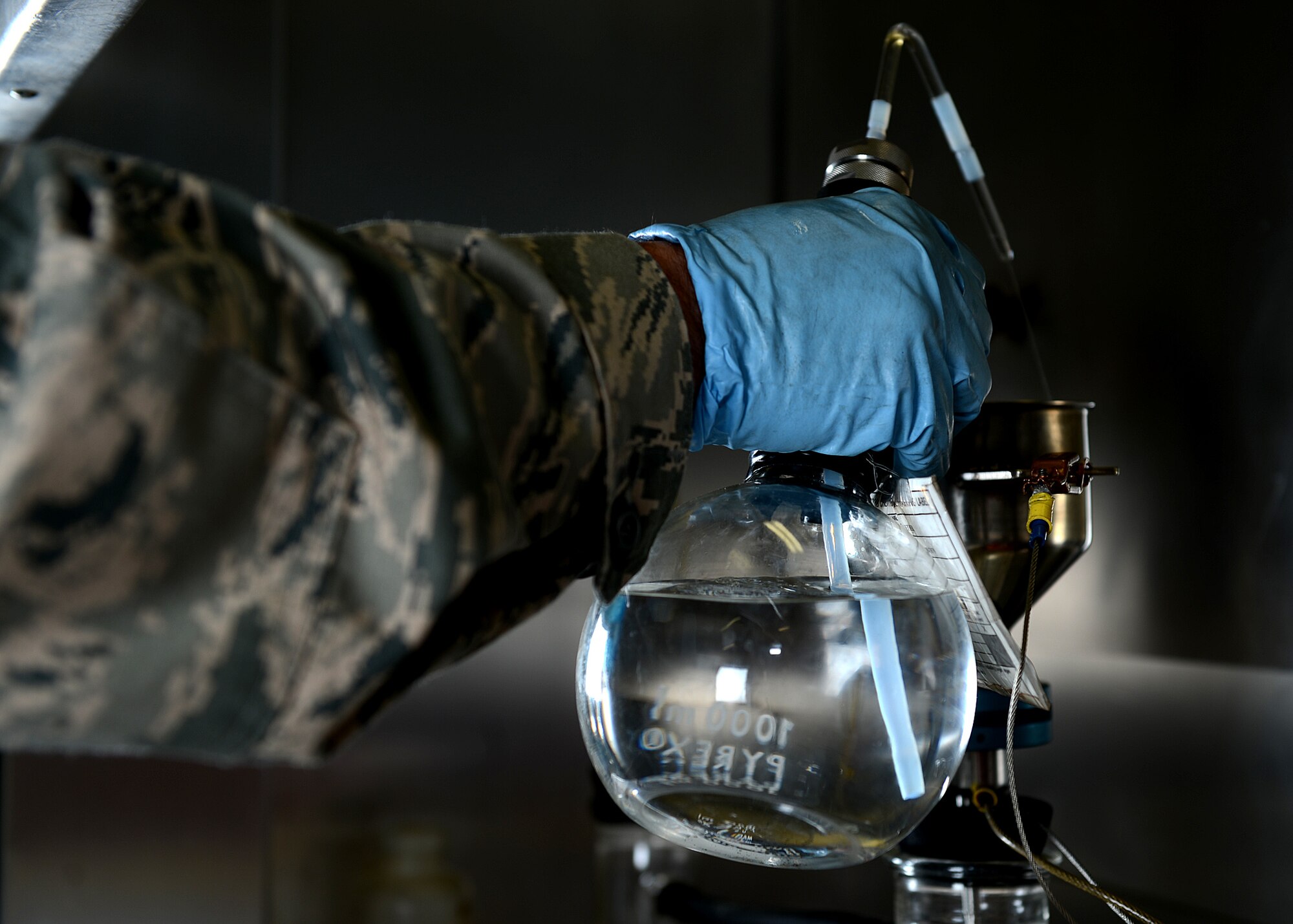U.S. Air Force Staff Sgt. Mark Harschfeld, 52nd Logistics Readiness Squadron NCO in charge of the fuels laboratory and Helena, Mont., native, performs a bottle-method test on JP-8 fuel at Spangdahlem Air Base, Germany, May 23, 2014. On average, 48,000 gallons of JP-8 fuel is issued daily. (U.S. Air Force photo by Airman 1st Class Kyle Gese/Released)