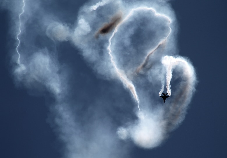 A member of the Turkish air force demonstration team, Solo Turk, performs before a crowd at this year's Berlin Trade and Air Show, Berlin, May 21, 2014. Solo Turk flies the F-16C and began performing air shows in 2010. The first three days of the show are dedicated to displaying the latest developments and products in the aerospace industry to spectators or visitors. The last three days of the show are dedicated to inviting the public out to display the aircraft and technologies of each participating nation and to enjoy the aerial demonstrations being put on by participating nations. (U.S. Air Force photo by 2nd Lt. Clay Lancaster/Released)
