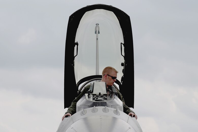 U.S. Air Force Capt. Casey Manning, F-16 Fighting Falcon fighter aircraft pilot from Spangdahlem Air Base, Germany, performs post-flight procedures shortly after arriving at this year’s Berlin Trade and Air Show, Berlin, May 20, 2014.  The trade show, which is held every two years, represents an opportunity for U.S. and military allies to showcase their leadership in aerospace technologies and to show spectators the type of equipment being used by the U.S. that is critical to the success of current and future military operations. (U.S. Air Force photo by 2nd Lt. Clay Lancaster/Released)