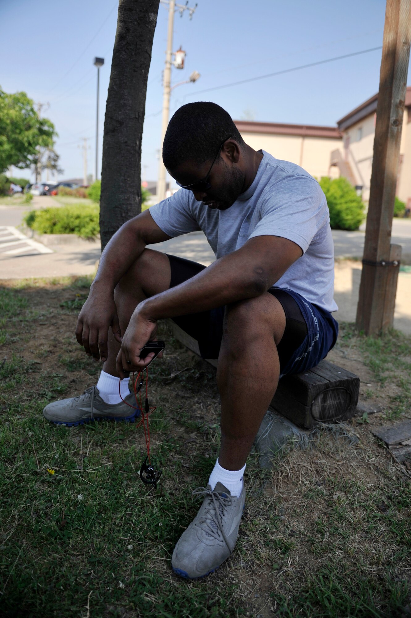 Staff Sgt. Albert Banks, 51st Munitions Squadron, rests after a 2.8 mile run during the Evolution 2 Excellence program May 21, on Osan Air Base, Republic of Korea. The intent of the program is to help Airmen reach or maintain a 90 percent or higher on their fitness assessment test. (U.S. Air Force photo by Senior Airman David Owsianka)