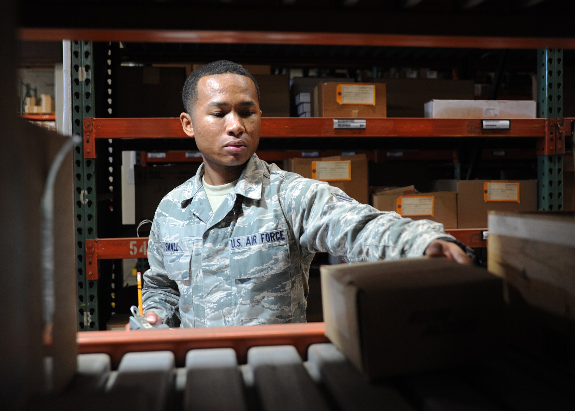 Senior Airman Arsenio Small, 35th Logistics Readiness Squadron inspections manager, reviews an item on his checklist in the LRS warehouse at Misawa Air Base, Japan, May 28, 2014. As the inspections manager, Small must ensure more than 10,000 assets are serviceable before they are issued to customers. (U.S. Air Force photo/Staff Sgt. Alyssa C. Wallace) 