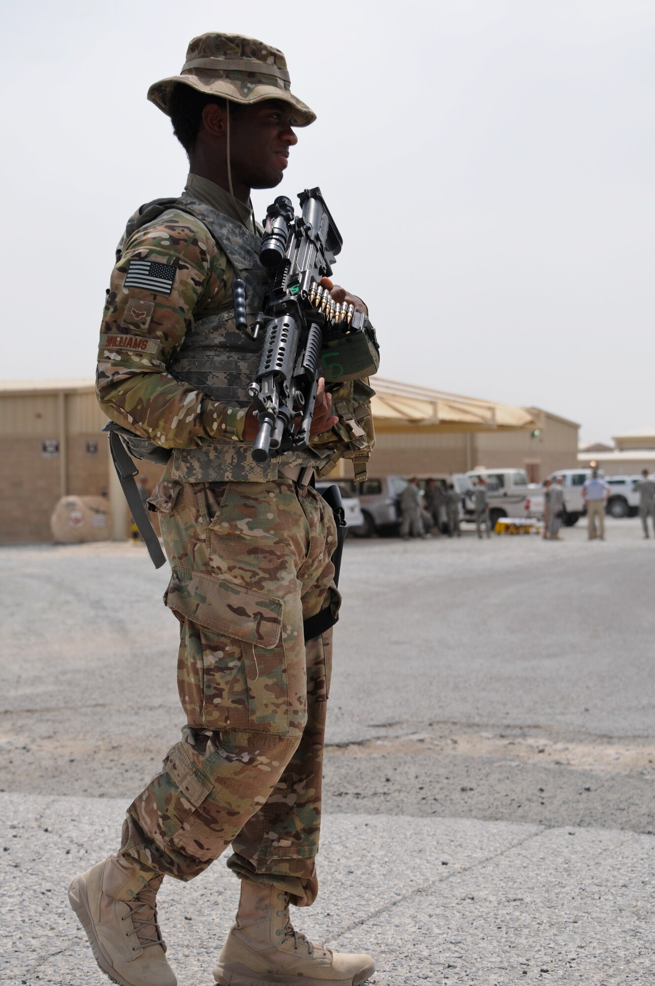 Airman 1st Class Jeffrey Williams, 386th Expeditionary Security Forces Squadron, patrols the scene of a mock accident May 23, 2014 at an undisclosed location in Southwest Asia. Members of the 386th Air Expeditionary Wing participated in a base exercise that included multiple scenarios to challenge and train Airmen on potential threats in a deployed environment. (U. S. Air Force photo by 1st Lt. Holli Nelson)
