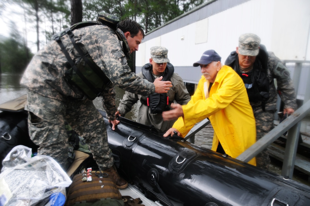 Soldiers search through flooded areas in Moss Point, Miss., for stranded residents following Isaac, which has been downgraded to a tropical depression, Aug. 30, 2012. The soldiers, assigned to Support Company, 2nd Battalion, 20th Special Forces Group, and other Mississippi National Guardsmen have rescued more than 350 individuals over the past fewdays in Jackson, Hancock, and Harrison counties along the Gulf Coast. 
