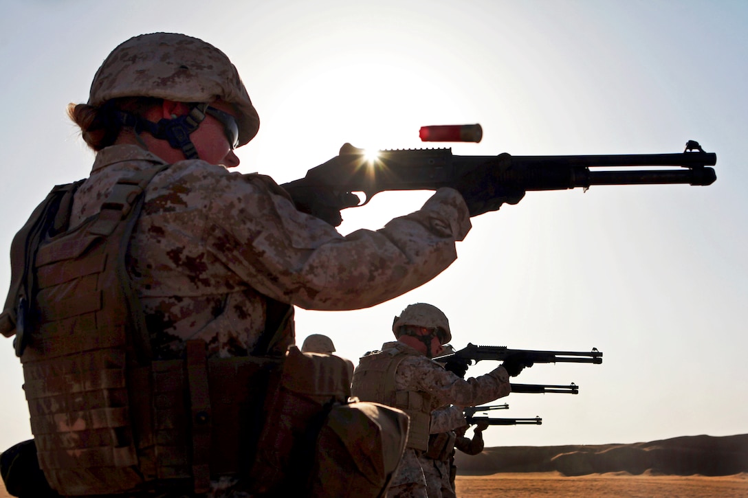 U.S. Marine Corps Sgt. Regina Smith fires an M1014 shotgun during a shotgun qualification on Udairi Range, Kuwait, Aug. 14, 2012. Smith, a radio supervisor, is assigned to Combat Logistics Battalion 24, 24th Marine Expeditionary Unit. The Marines are in Kuwait as part of the unit's sustainment training package, serving as a U.S. Central Command theater reserve force to support maritime security and theater security cooperations.  
