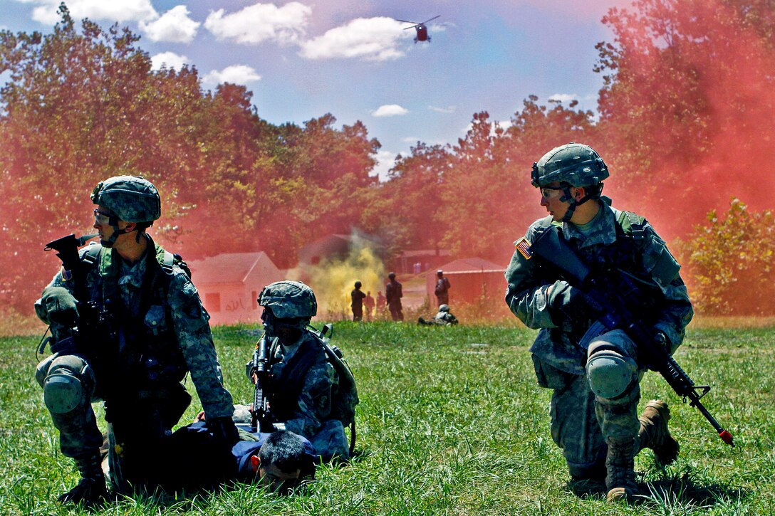 Army cadets receive further instructions as they wait near the landing zone for a helicopter to retrieve them during field training on Camp Buckner at the U.S. Military Academy at West Point, N.Y., July 21, 2012. 
