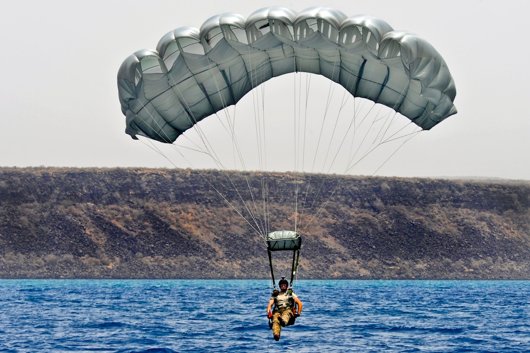 A U.S. airman parachutes into the drop zone during a personnel recovery exercise in the Gulf of Tadjoura, Djibouti, July 19, 2012. The paraescueman is assigned to the 82nd Expeditionary Rescue Squadron. Members of the 81st Expeditionary Rescue Squadron and Spanish navy also participated in the exercise, which allowed pararescuemen to practice insertion, emergency medical and extraction procedures to support Combined Joint Task Force Horn of Africa.  
