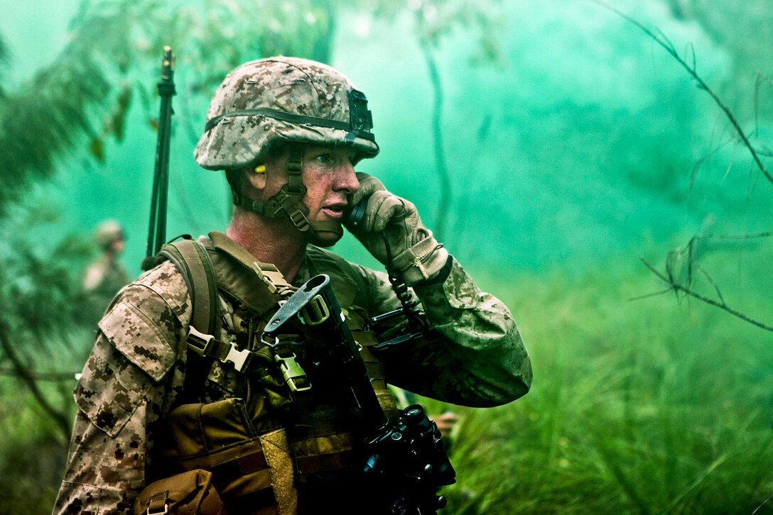 U.S. Marine Corps Staff Sgt. Bryan Robbins calls for mortar support during a live-fire exercise on Shoalwater Bay Training Area, Queensland, Australia, July 13, 2012. Robbins is a platoon sergeant assigned to 3rd Platoon, Company G., Battalion Landing Team 2nd Battalion, 1st Marines, 31st Marine Expeditionary Unit. Exercise Hamel 2012 is a multi-national training evolution between the U.S. Marine Corps, Australian Army and New Zealand Army, aimed at certifying the Australian 1st Brigade.  

