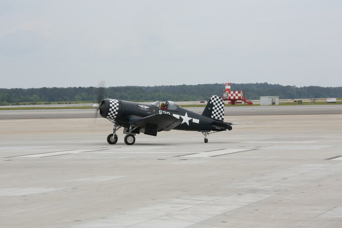 An F4U Corsair, piloted by Chris Avery, sits on the runway during the 2014 MCAS Cherry Point “Inspiration to Innovation” Air Show May 17. Avery is now an airline pilot who occasionally performs aerobatic air shows in a F4U Corsair, an aircraft used during World War II. It was the last aircraft to use three-bladed propeller technology.


