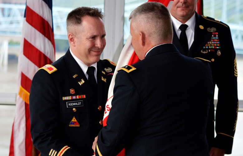 Maj. Gen. Todd Semonite (Right), U.S. Army Corps of Engineers deputy chief of Engineers, transfers command of the Great Lakes and Ohio River Division to Col. Steven J. Roemhildt during a change of command ceremony May 28, 2014 at the Great American Ballpark Riverfront Club in Cincinnati, Ohio.  Roemhildt took command from Brig. Gen. Margaret Burcham.