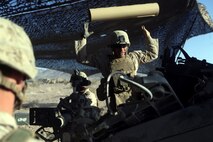 Lance Corporal Joshua Sujka, 22, an artilleryman with Fox Battery, 2nd Battalion, 11th Marines, loads the powder in to the M777A2 lightweight howitzer during Exercise Desert Scimitar at Marine Corps Air Ground Combat Center Twentynine Palms, Calif., May 6, 2014. Sujka, a native of Okinawa, Japan, is the number two man for gun one of the battery during the exercise. Desert Scimitar is a two-week, combined-element exercise to prepare Marines for future deployments. (U.S. Marine Corps photo by Lance Cpl. Ashton Buckingham)