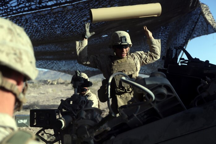 Lance Corporal Joshua Sujka, 22, an artilleryman with Fox Battery, 2nd Battalion, 11th Marines, loads the powder in to the M777A2 lightweight howitzer during Exercise Desert Scimitar at Marine Corps Air Ground Combat Center Twentynine Palms, Calif., May 6, 2014. Sujka, a native of Okinawa, Japan, is the number two man for gun one of the battery during the exercise. Desert Scimitar is a two-week, combined-element exercise to prepare Marines for future deployments. (U.S. Marine Corps photo by Lance Cpl. Ashton Buckingham)