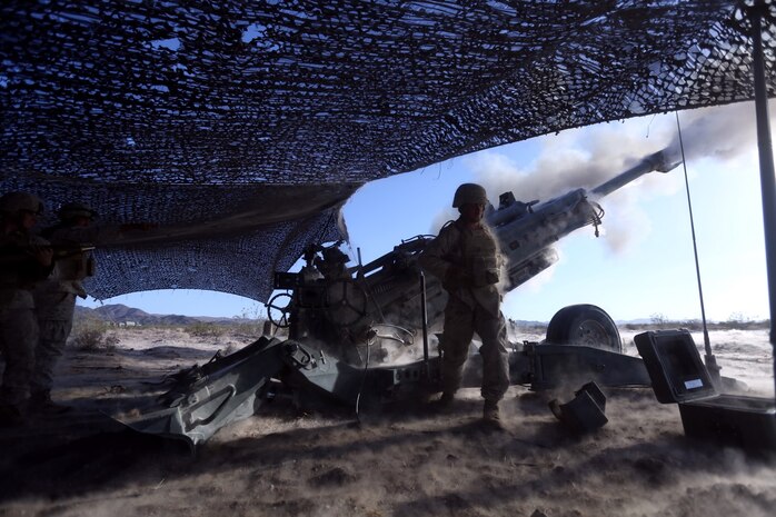 Private Korey Kelemen, 22, an artilleryman with Fox Battery, 2nd Battalion 11th Marines, pulls the lanyard of a M777A2 lightweight howitzer during Exercise Desert Scimitar at Marine Corps Air Ground Combat Center Twentynine Palms, Calif., May 6, 2014. Kelemen, a native of Detroit, Mich., is the ammo man for gun one of the battery during the exercise. Desert Scimitar is a two-week, combined-element exercise to prepare Marines for future deployments. (U.S. Marine Corps photo by Lance Cpl. Ashton Buckingham)