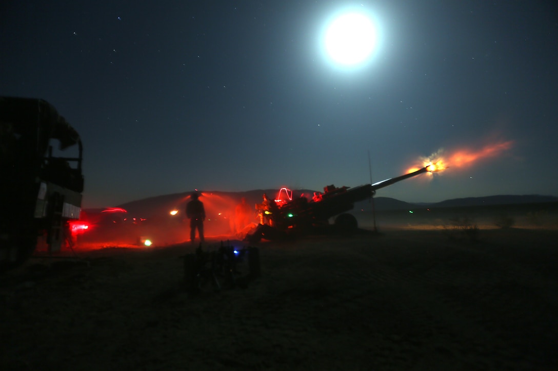 Marines with Fox Battery, 2nd Battalion, 11th Marine Regiment, fire artillery rounds during Exercise Desert Scimitar at Marine Corps Air Ground Combat Center Twentynine Palms, Calif., May 6, 2014.  Desert Scimitar is a two-week, combined-element exercise to prepare Marines for future deployments. (U.S. Marine Corps photo by Lance Cpl. Ashton Buckingham) 