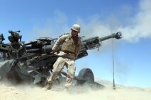 Private First Class James Miller, 21, an artilleryman with Fox Battery, 2nd Battalion, 11th Marines,  pulls the lanyard of a M777A2 lightweight howitzer during Exercise Desert Scimitar at Marine Corps Air Ground Combat Center Twentynine Palms, Calif., May 6, 2014.  Miller, a native of Baltimore, Md., is the assistant gunner for gun one of the battery during the exercise. Desert Scimitar is a two-week, combined-element exercise to prepare Marines for future deployments. (U.S. Marine Corps photo by Lance Cpl. Ashton Buckingham)