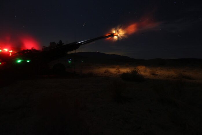 Marines with Fox Battery, 2nd Battalion, 11th Marine Regiment, fire artillery rounds during Exercise Desert Scimitar at Marine Corps Air Ground Combat Center Twentynine Palms, Calif., May 6, 2014.  Desert Scimitar is a two-week, combined-element exercise to prepare Marines for future deployments. (U.S. Marine Corps photo by Lance Cpl. Ashton Buckingham)