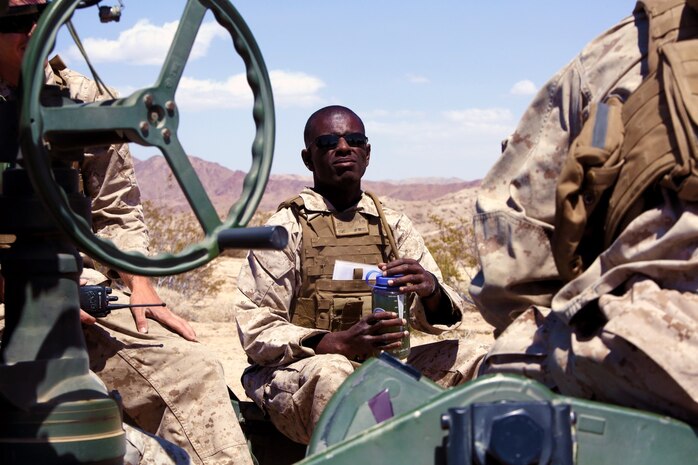 Sargent Byron Perry, 28, an artilleryman with Fox Battery, 2nd Battalion, 11th Marines, rest in-between fire missions during Exercise Desert Scimitar at Marine Corps Air Ground Combat Center Twentynine Palms, Calif., May 6, 2014.  Perry, a native of Oceanside, Calif., is the assistant chief for gun one of the battery during the exercise. Desert Scimitar is a two-week, combined-element exercise to prepare Marines for future deployments. (U.S. Marine Corps photo by Lance Cpl. Ashton Buckingham)
