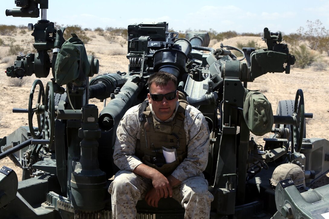 Sargent Jacob Seguin, 25, an artilleryman with Fox Battery, 2nd Battalion, 11th Marines,  sits in the chief’s chair of an M777A2 lightweight howitzer during Exercise Desert Scimitar at Marine Corps Air Ground Combat Center Twentynine Palms, Calif., May 6, 2014.  Seguin, a native of Woodbridge, Va., is the chief for gun one of the battery during the exercise. Desert Scimitar is a two-week, combined-element exercise to prepare Marines for future deployments. (U.S. Marine Corps photo by Lance Cpl. Ashton Buckingham)