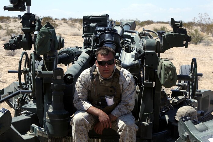 Sargent Jacob Seguin, 25, an artilleryman with Fox Battery, 2nd Battalion, 11th Marines,  sits in the chief’s chair of an M777A2 lightweight howitzer during Exercise Desert Scimitar at Marine Corps Air Ground Combat Center Twentynine Palms, Calif., May 6, 2014.  Seguin, a native of Woodbridge, Va., is the chief for gun one of the battery during the exercise. Desert Scimitar is a two-week, combined-element exercise to prepare Marines for future deployments. (U.S. Marine Corps photo by Lance Cpl. Ashton Buckingham)