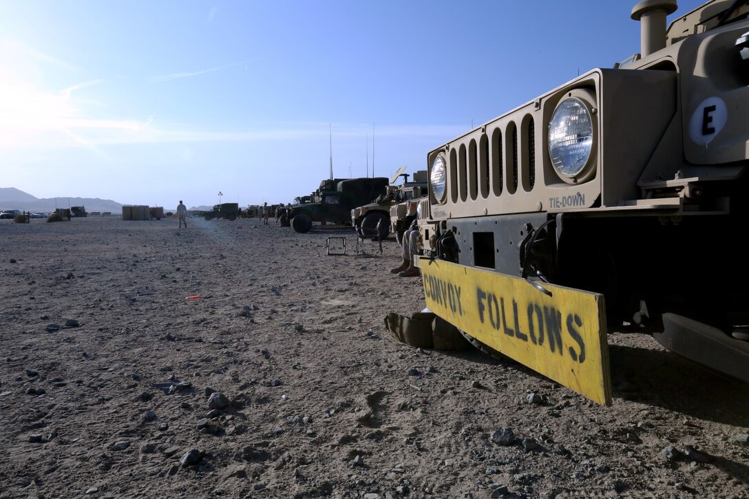 Marines prepare to depart sand hill at Marine Corps Air Ground Combat Center Twentynine Palms, Calif., for the main push to start Exercise Desert Scimitar, May 5, 2014. Desert Scimitar is a two-week, combined-element exercise to prepare Marines for future deployments. (U.S. Marine Corps photo by Lance Cpl. Ashton Buckingham)