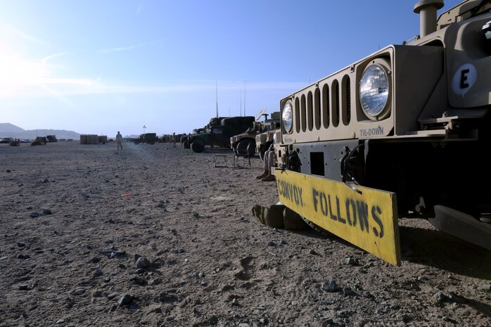 Marines prepare to depart sand hill at Marine Corps Air Ground Combat Center Twentynine Palms, Calif., for the main push to start Exercise Desert Scimitar, May 5, 2014. Desert Scimitar is a two-week, combined-element exercise to prepare Marines for future deployments. (U.S. Marine Corps photo by Lance Cpl. Ashton Buckingham)
