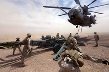 Marines with Combat Logistics Battalion 1 prepare to hook a M777A2 lightweight howitzer up to a Ch-53 super stallion helicopter during Exercise Desert Scimitar at Marine Corps Air Ground Combat Center Twentynine Palms, Calif., May 8 2014. Desert Scimitar is a two-week, combined-element exercise to prepare Marines for deployments.  The Ch-53 is able to transport a howitzer quickly to locations that would otherwise be inaccessible. (U.S. Marine Corps photo by Lance Cpl. Ashton Buckingham)