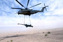 A Ch-53 super stallion helicopter lifts a M777A2 lightweight howitzer during Exercise Desert Scimitar at Marine Corps Air Ground Combat Center Twentynine Palms, Calif., May 8 2014. Desert Scimitar is a two-week, combined-element exercise to prepare Marines for deployments.  The Ch-53 is able to transport a howitzer quickly to locations that would otherwise be inaccessible. (U.S. Marine Corps photo by Lance Cpl. Ashton Buckingham)