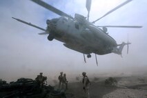 Marines with Combat Logistics Battalion 1 prepare to hook the M777A2 lightweight howitzer up to a Ch-53 super stallion helicopter during Exercise Desert Scimitar at Marine Corps Air Ground Combat Center Twentynine Palms, Calif., May 8 2014. Desert Scimitar is a two-week, combined-element exercise to prepare Marines for deployments.  The Ch-53 is able to transport a howitzer quickly to locations that would otherwise be inaccessible. (U.S. Marine Corps photo by Lance Cpl. Ashton Buckingham)