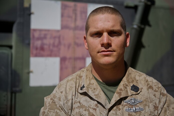 Petty Officer 2nd Class Daniel Wagner, a hospital corpsman with Headquarters Battalion, 1st Marine Division, and his fellow Sailors are responsible for the health and medical care of the service members participating in Exercise Desert Scimitar at Marine Corps Air Ground Combat Center Twentynine Palms, Calif., May 14, 2014. Wagner routinely improvises medical treatment while in the field. He understands the work tempo of the Marines requires the battalion aid station to be creative when continuing treatment for their patients.