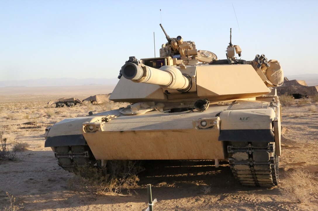 Marines with Alpha Company, 1st Tank Battalion, put their M1A1 abrams main battle tank into a defensive position during Exercise Desert Scimitar aboard Marine Corps Air Ground Combat Center Twentynine Palms, Calif., May 11, 2014. The training gave the Marines the opportunity to refine and rehearse essential combat skills needed in a battlefield environment. Desert Scimitar is an annual exercise that includes elements from the I Marine Expeditionary Force. The exercise focused on conventional operations and provided realistic training that prepared Marines for overseas operations. (U.S. Marine Corps photo by Cpl. Christopher J. Moore/Released)