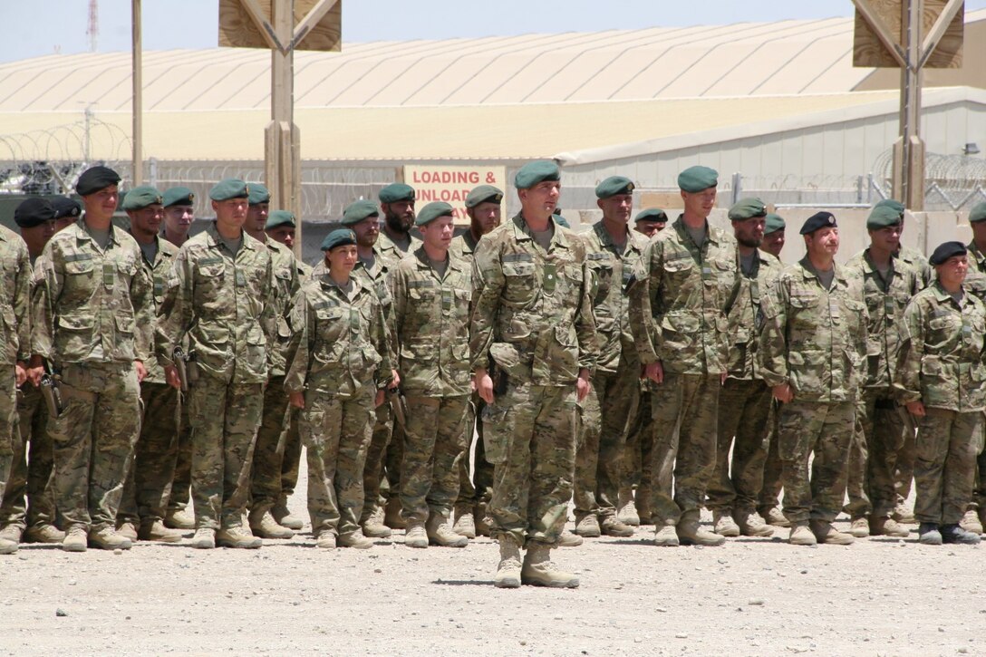 Soldiers with the Danish Contingent stand in formation during their end of mission ceremony aboard Camp Bastion, Afghanistan, May 20, 2014. This year marked the 17th rotation and final deployment to Afghanistan for DANCON. Since their first mission began, more than 18,000 Danish soldiers have deployed to the country.
